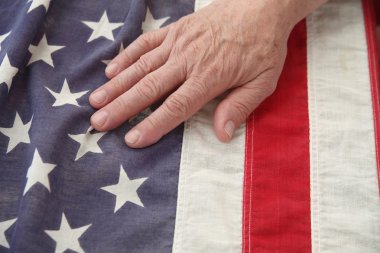 Man with hand on USA flag clipart