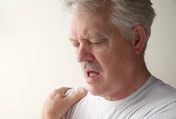 Mann mit Schleimbeutelentzündung — Stockfoto