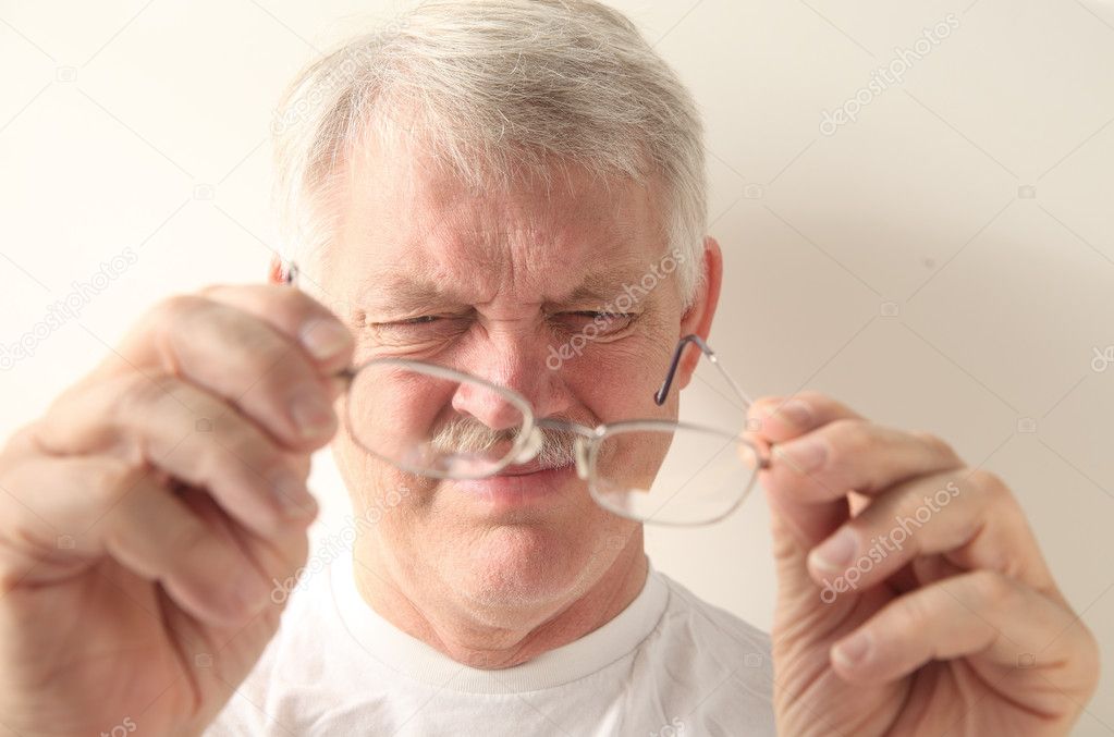 Senior man with dirty glasses