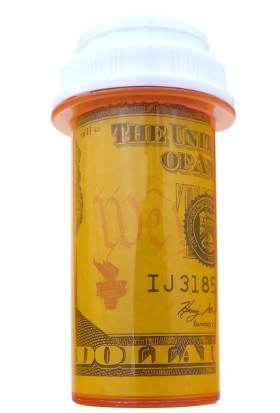 Flacon de pastile cu bani — Fotografie, imagine de stoc