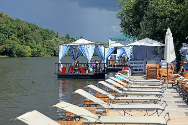 stock image Lounge chairs ashore Moscow river