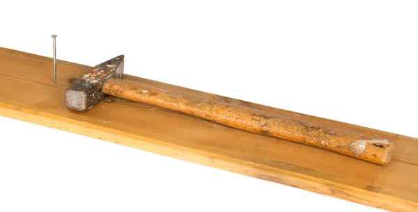 Hammer, nail and wooden board — Stock Photo, Image