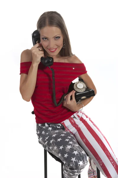 Mulher com um telefone antigo — Fotografia de Stock