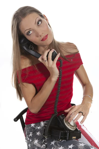 Mulher com um telefone antigo — Fotografia de Stock