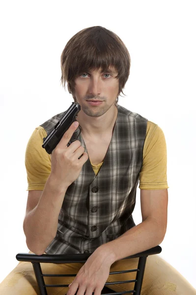 Genç bir adam elinde bir tabanca ile — Stok fotoğraf