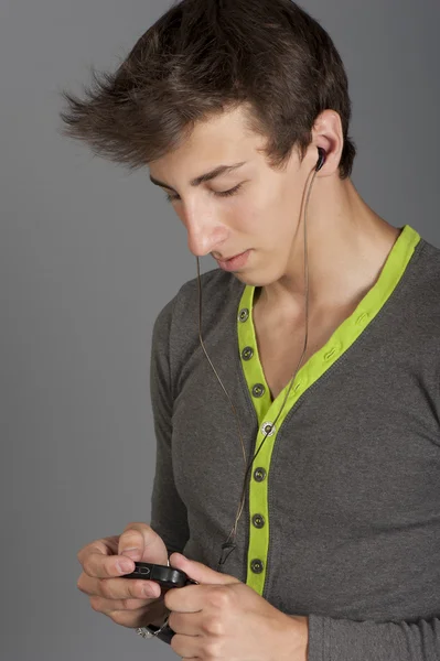 Young man listens to music Stock Photo