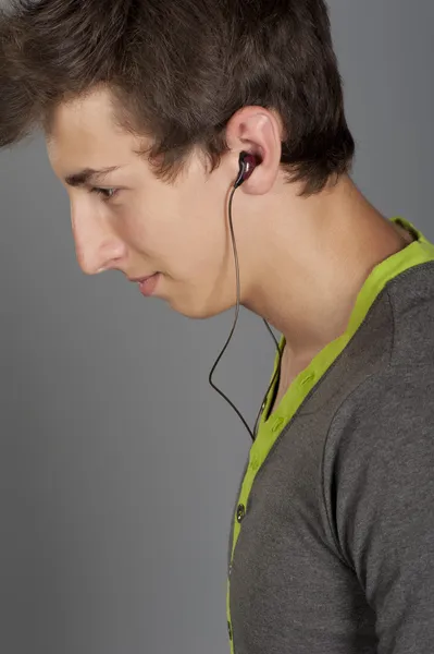 Young man listens to music Royalty Free Stock Photos
