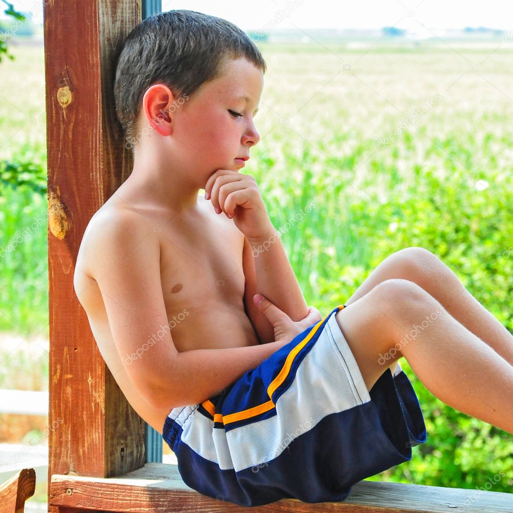Small Boy Taking a Break on a Hot Summer Day