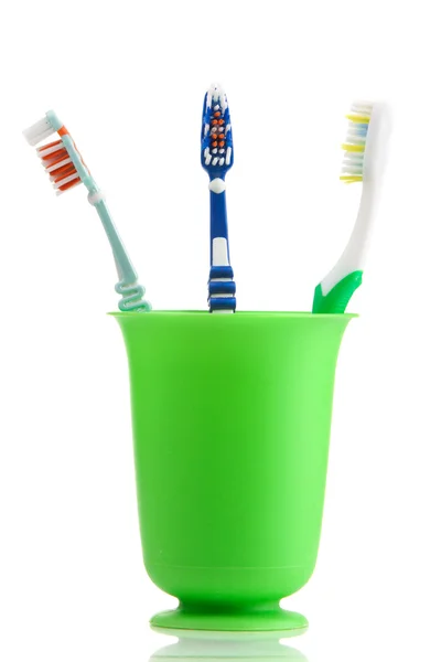 Tandenborstels in beker — Stockfoto