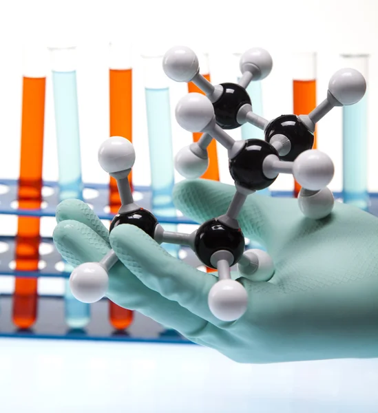 stock image Scientist working in a laboratory , glass containing liquid color