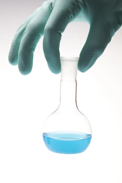 stock image Scientist working in a laboratory , glass containing liquid color