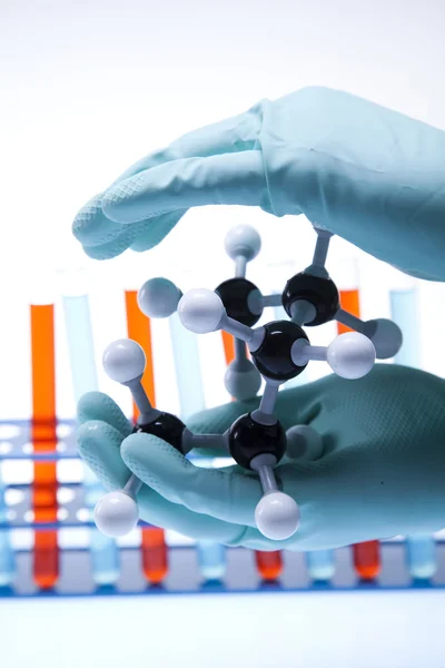 stock image Scientist working in a laboratory , glass containing liquid color