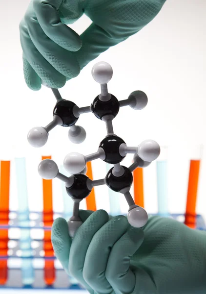 Stock image Scientist working in a laboratory , glass containing liquid color