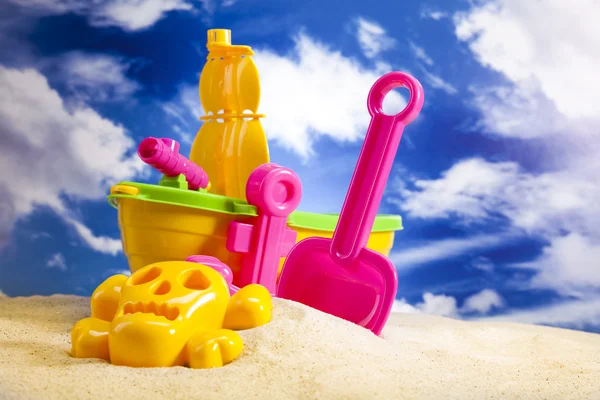 Colorful plastic toys on the beach — Stock Photo, Image