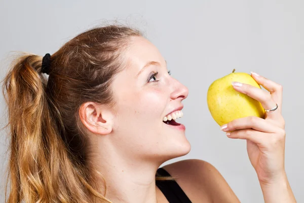 Portrait of woman with apple — Stock Photo, Image