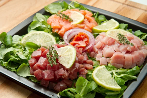Salmon, tuna and swordfish tartare — Stock Photo, Image