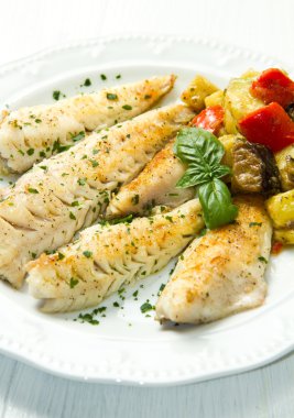 Fish fillet with vegetables clipart