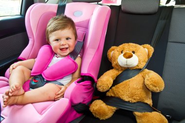 Baby girl smile in car clipart