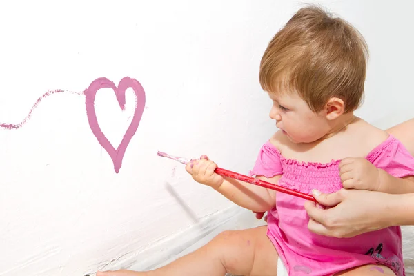 Little girl paint on a board — Stock Photo, Image