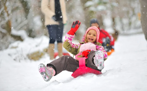 Little girl on sleigh — Stock Photo, Image