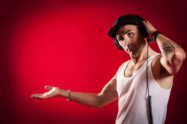 DJ in front of a red Background — Stock Photo, Image