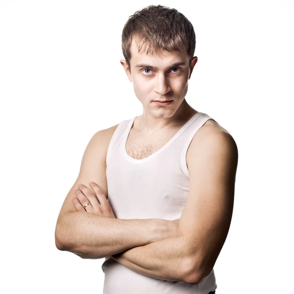 Young man with crossing hands on white — Stock Photo, Image