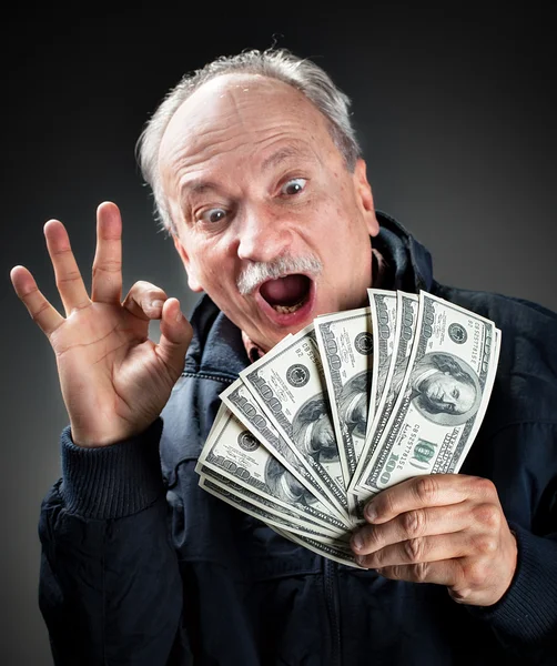 Szczęśliwy osób starszych z fanem pieniądze — Zdjęcie stockowe