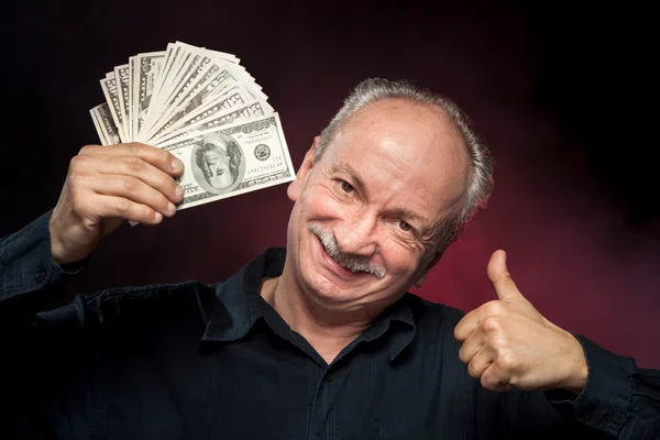 Starszy mężczyzna wyświetlone wentylator pieniędzy — Zdjęcie stockowe