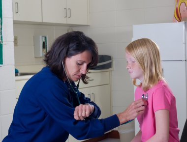 Nurse with Stethoscope checking heart rate clipart