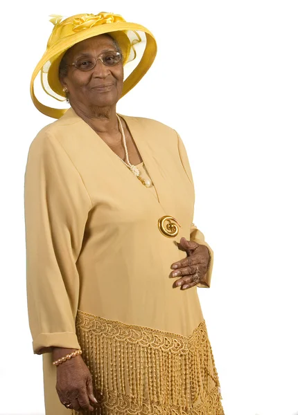 노란 모자를 착용 하는 오래 된 아프리카계 미국인 여자 스톡 이미지