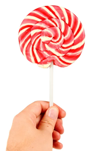 Candy roze spiraal lolly in de hand — Stockfoto
