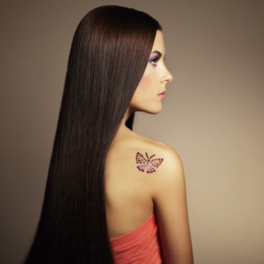 Fashion photo of a young woman with dark hair clipart