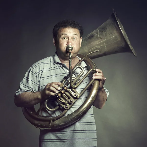 stock image Portrait of an old man close up playing the trumpet