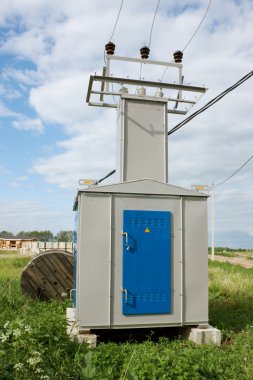 Transformer substation in countryside clipart