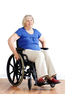Senior woman in wheelchair over white clipart