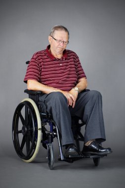 Sad senior man in wheelchair clipart