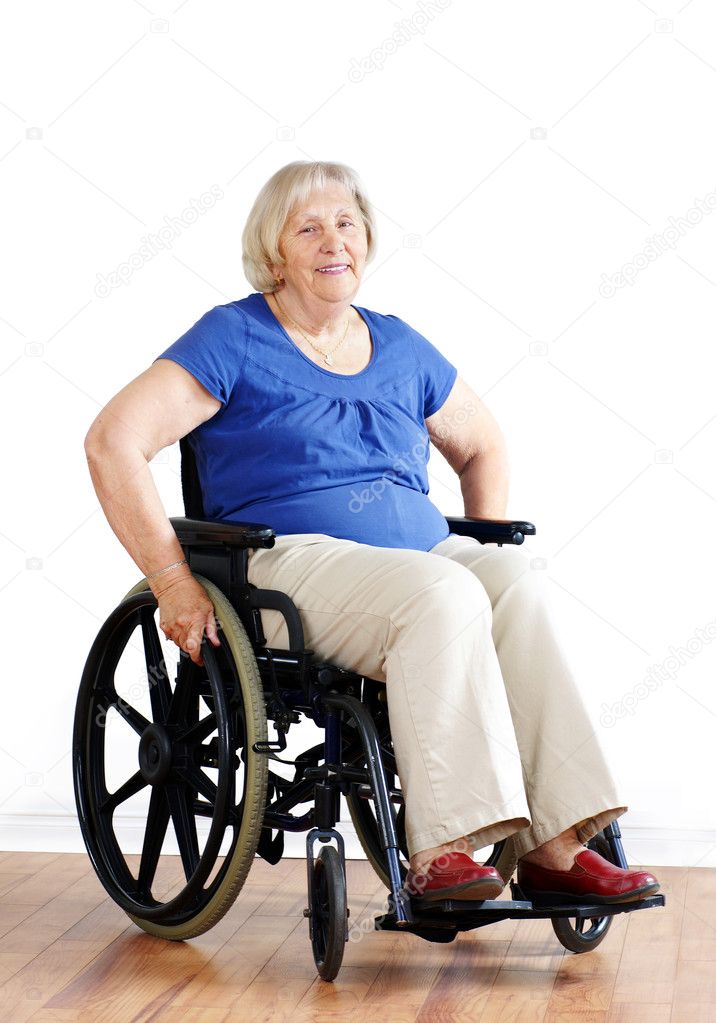 Senior woman in wheelchair over white