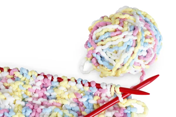 Red needles and baby colors knitting — Stock Photo, Image