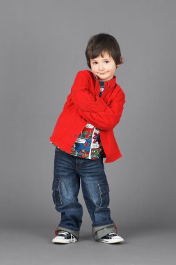 Cute little boy in red with smirk clipart