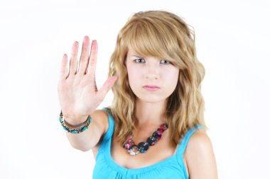 Young blond girl making STOP gesture clipart