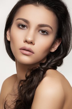 Portrait of sexy caucasian young woman. Natural spa beauty with pure skin. Beautiful model with natural make-up, clean skin and romantic hairstyle clipart