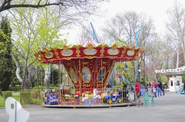 Carousel in park clipart