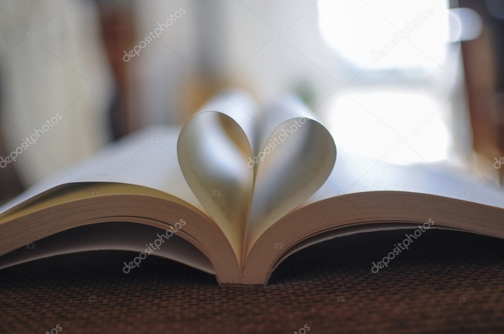 Pages of a book curved into a heart shape