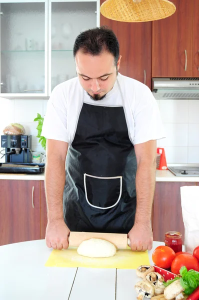 Stock image Young man in kitchen