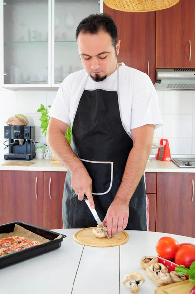 Stock image Young man in kitchen