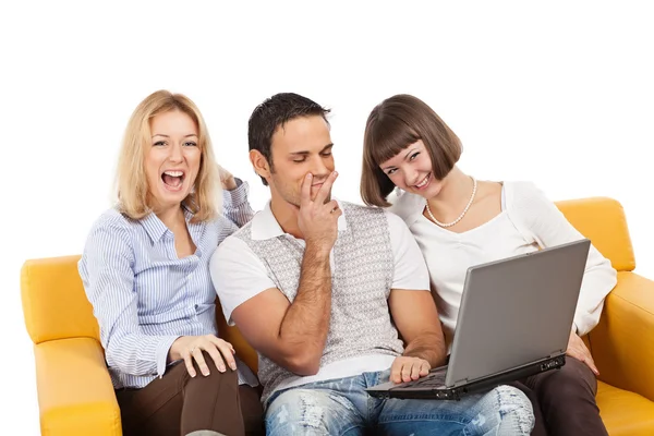 Amused young with laptop computer — Stock Photo, Image