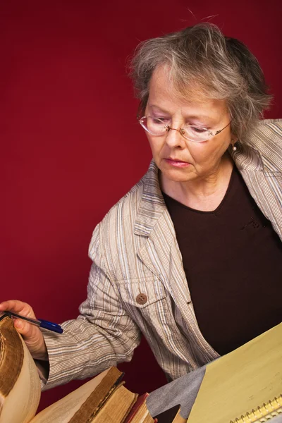 Professor with old books — Stock Photo, Image
