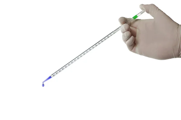 Pipette in hand — Stock Photo, Image
