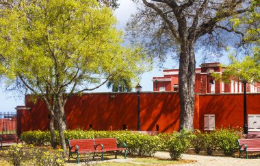 Public Park by Red Stucco Wall