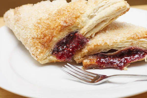 Fresh Raspberry Turnovers on a White Plate with Fork — Stock Photo, Image